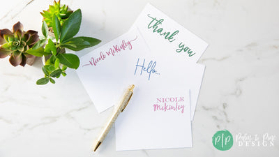 personalized stationery on granite background with plants