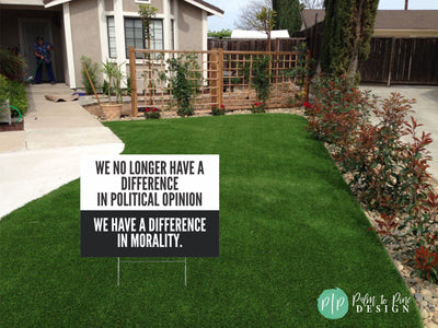 anti trump yard sign with political message about morality in front yard of house