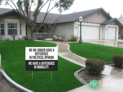 anti trump signs for protests in front yard that reads We no longer have a difference in political opinion, we have a difference in morality
