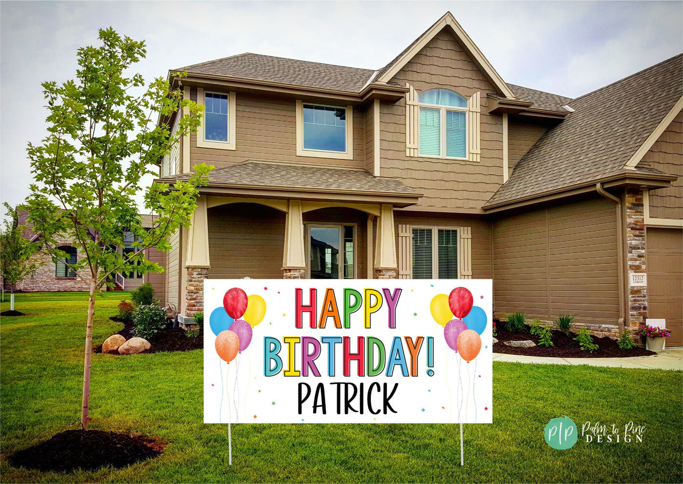 Decorative happy birthday banner with customizable name, printed in bright rainbow colors in front yard of house