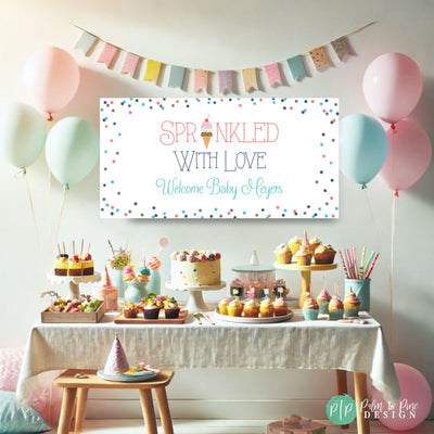 Pastel pink and blue ice cream-themed baby shower banner with ‘Sprinkled with Love’ message, ideal for welcoming guests to a baby shower party