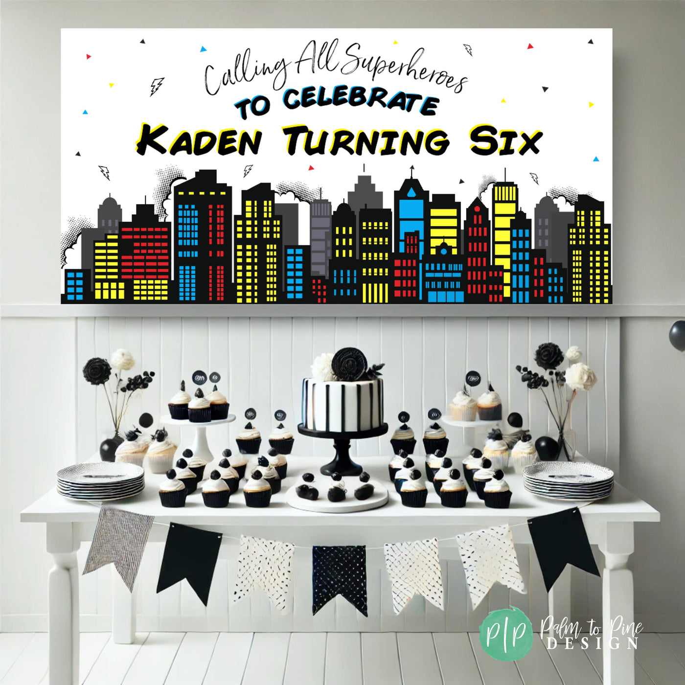 Superhero party banner with Comic book city skyline in front of a white and black dessert table