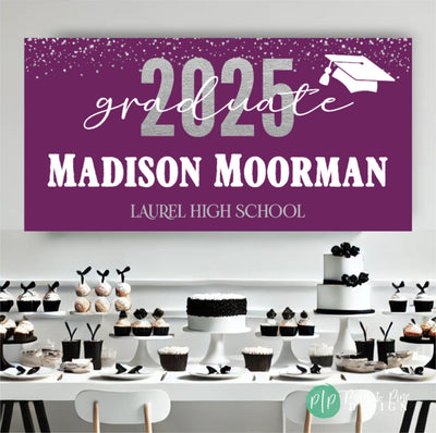 College Graduation Banner in front of elegant black and white dessert table