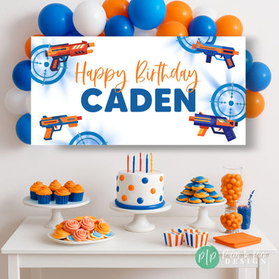 dart blaster party with personalized birthday banner and balloon garland in orange and blue