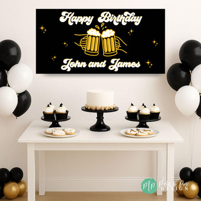Personalized Cheers and Beers milestone birthday banner in black, gold, and white with clinking beer mugs, hanging behind a dessert table set for a 50th birthday celebration.