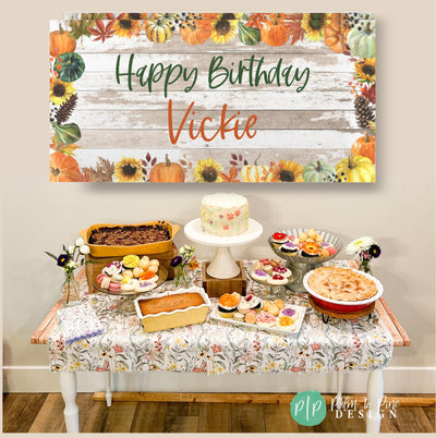 Fall themed birthday party for adult with rustic and charming dessert table featuring fall pies and personalized pumpkin birthday banner