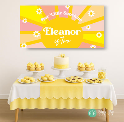 Our Little Sunshine and Daisy banner above a yellow dessert table, personalized with birthday girl’s name