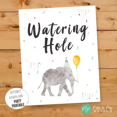 Watering Hole sign with elephant in party hat holding a balloon, rainbow confetti background, perfect for jungle or safari birthday party drinks