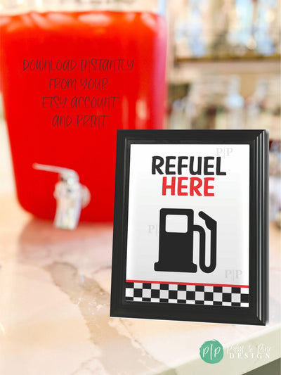 Racecar &quot;Refuel Here&quot; drink sign in front of red punch container