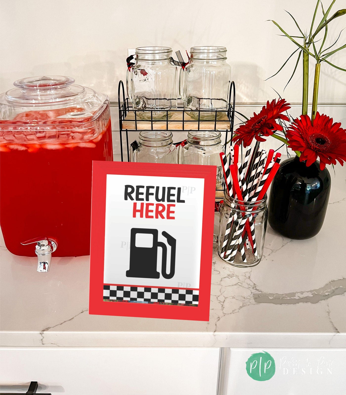 Race car birthday drink table sign with &quot;Refuel Here&quot; text at boys birthday party