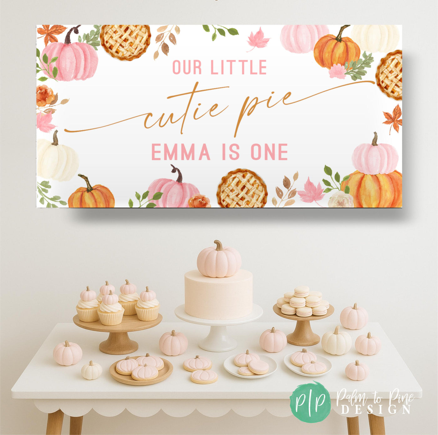 Our Little Cutie Pie Pumpkin themed birthday banner for girls with fall leaves and florals set behind a light pink pumpkin themed dessert table