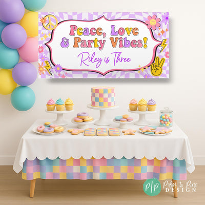Peace, love and party vibes retro girl birthday party with checkered pattern, peace signs, and lightning bolts in front of dessert table