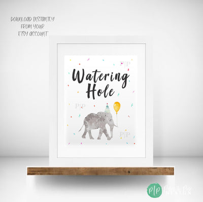 Jungle safari birthday drink station sign with elephant in party hat, balloon, and rainbow confetti background, text reads Watering Hole.