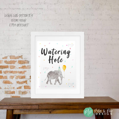 Printable Watering Hole party sign featuring elephant clipart, colorful confetti, balloon, and festive safari theme design.