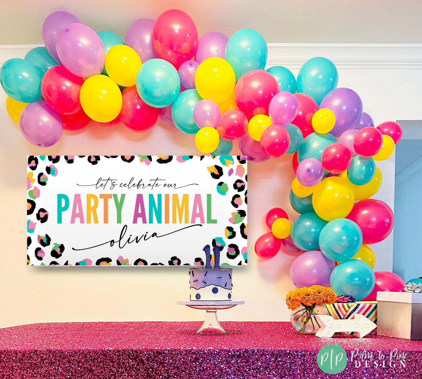 Safari rainbow animal print banner in colorful design with balloon garland
