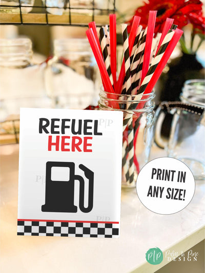 Drink station sign with gas pump and race car checkered flag