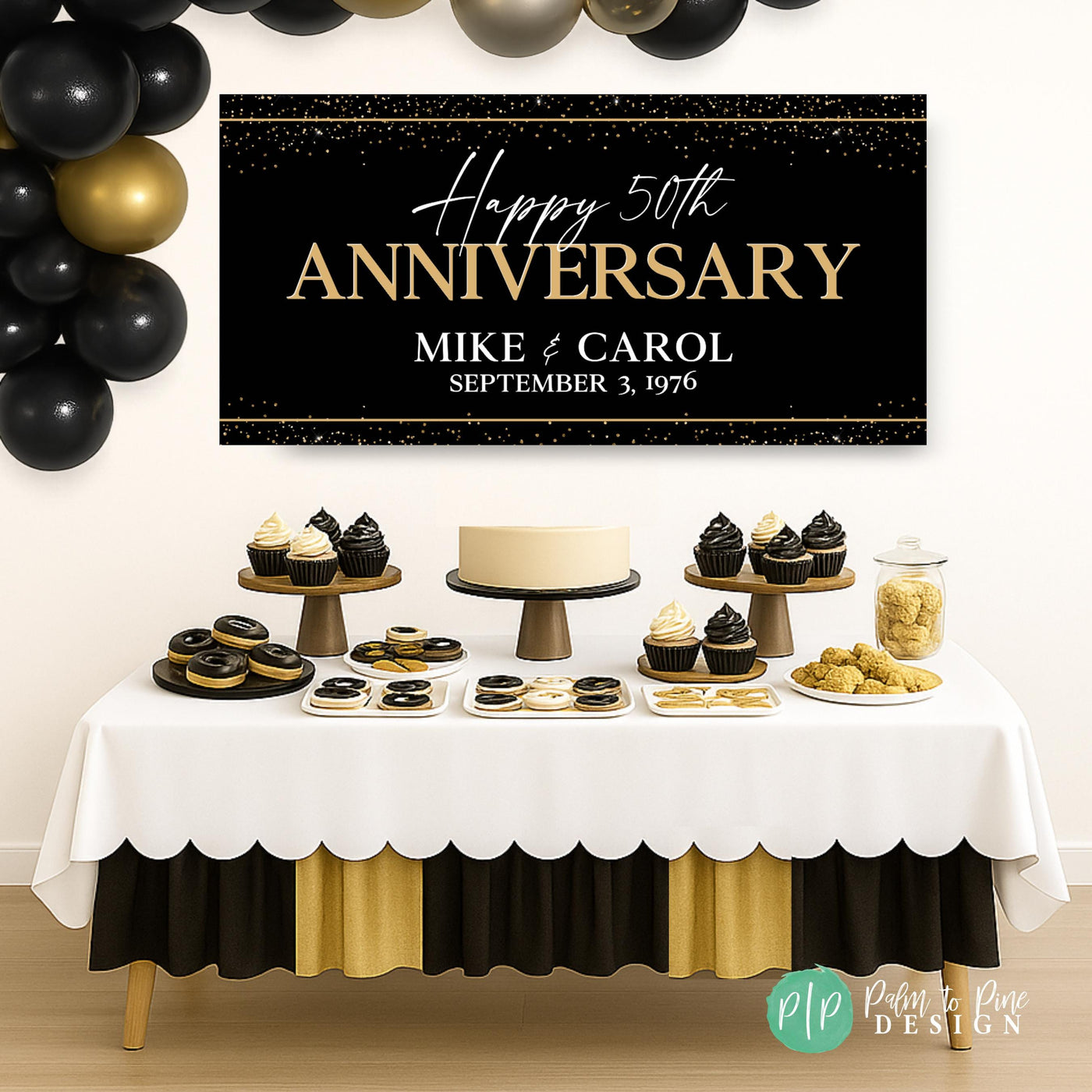 Golden 50th wedding anniversary banner hanging above a dessert table with cake and cupcakes