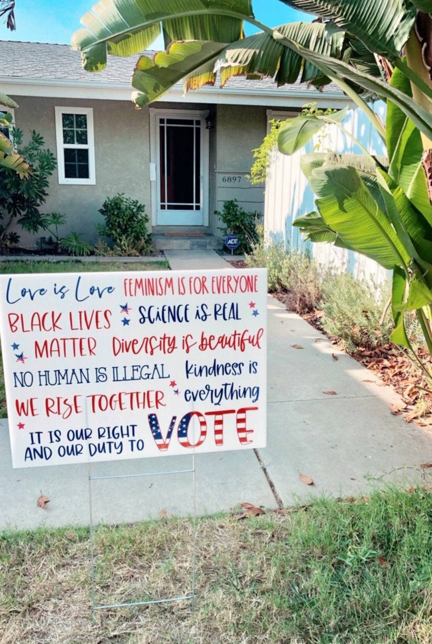 In this House yard sign